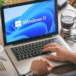 Man using Windows 11 laptop