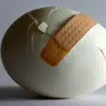 Sticking plaster on a broken egg