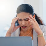 Frustrated woman at computer