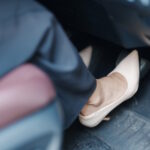Pressing brake pedal
