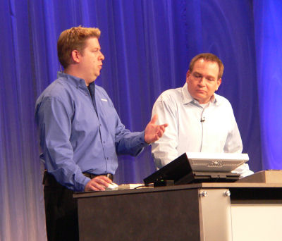 Microsoft technical group product manager Mike Woods demonstrating 'wrapping' processes in Web services, to Executive VP Bob Muglia.